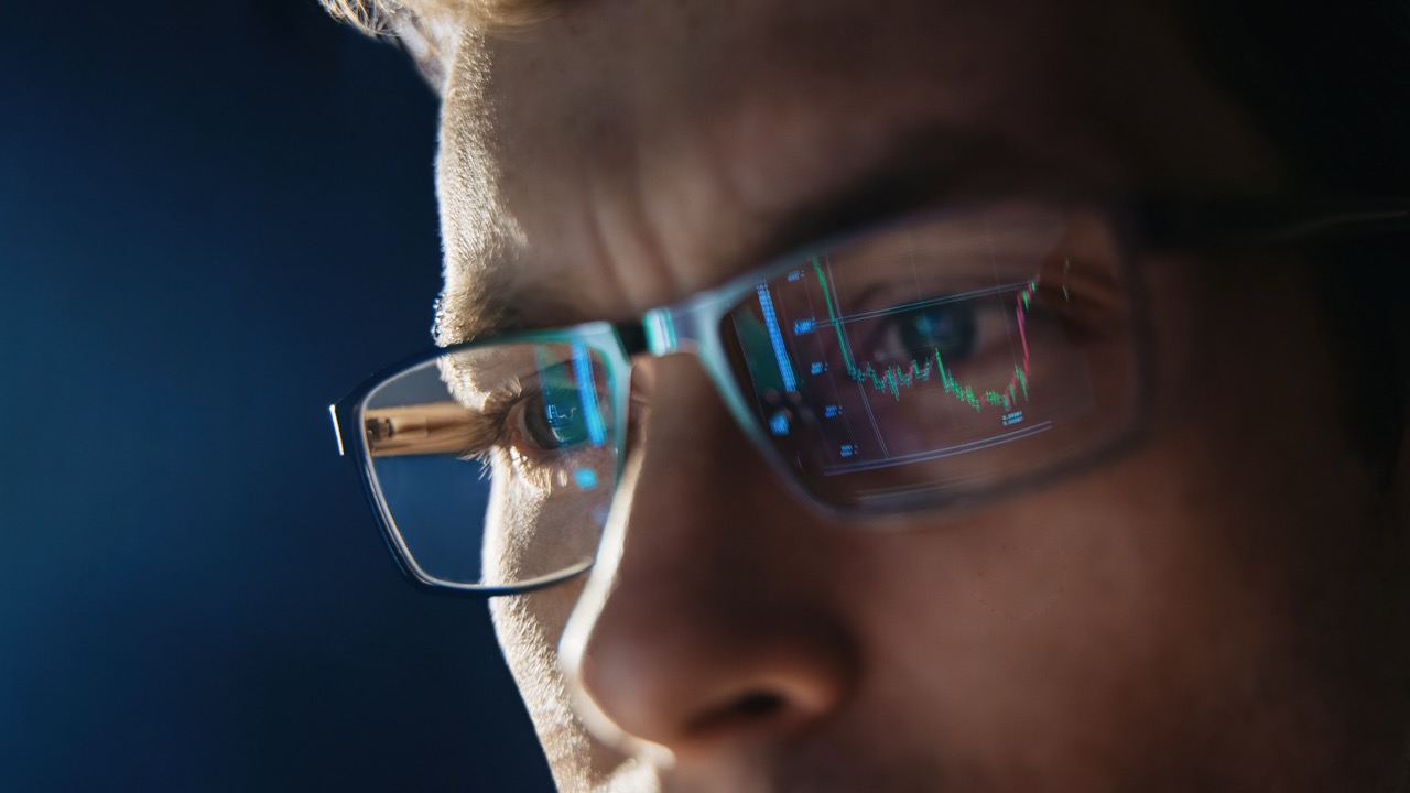 Close-up of smart glasses displaying digital information overlayed on the real world.