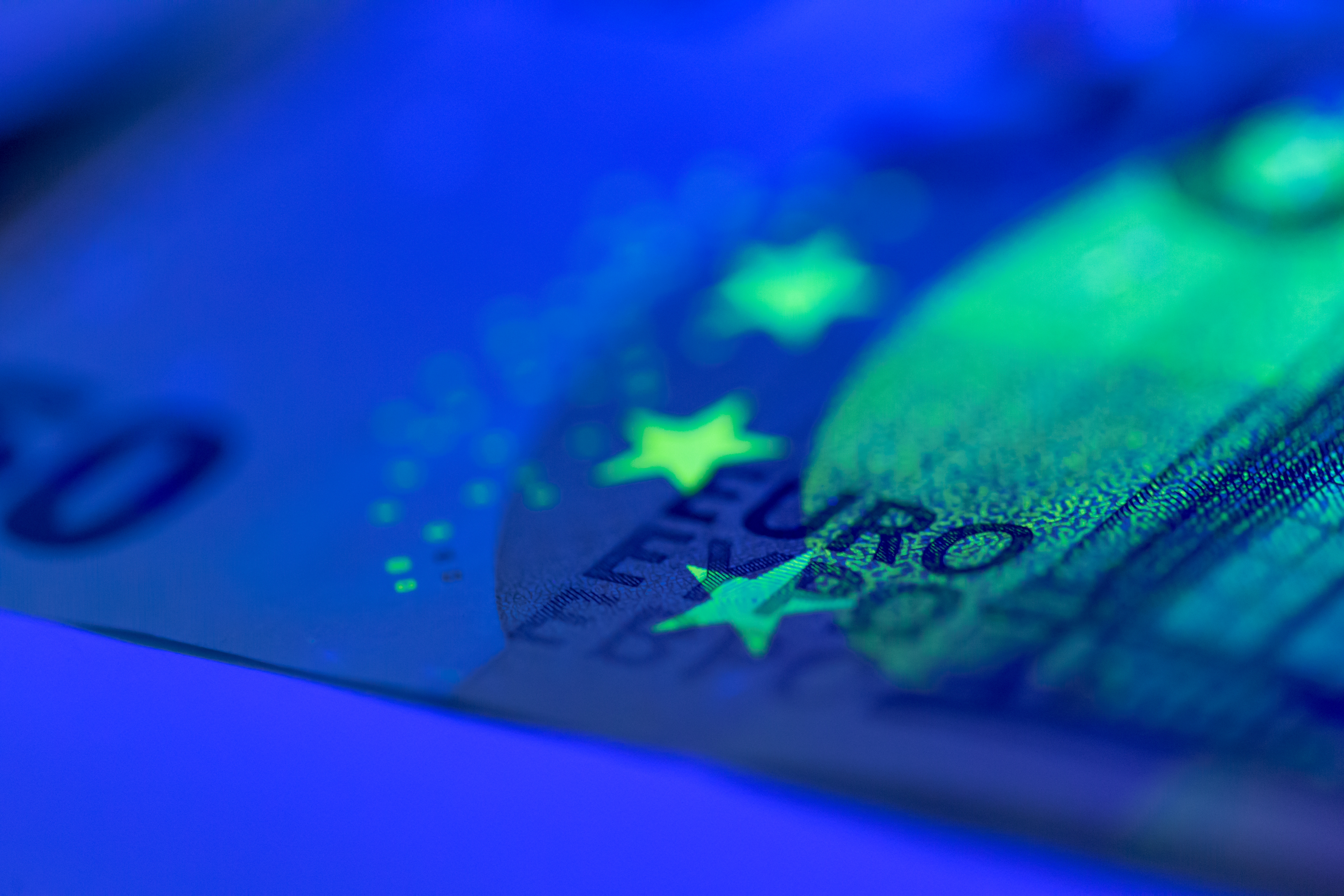 Euro banknotes and coins on a soft neutral background